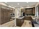 Spacious kitchen with stainless steel appliances, an island cooktop, and ample cabinet storage at 5210 E Danbury Rd, Scottsdale, AZ 85254