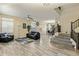 Inviting living room with staircase, lots of natural light, and a spacious floorplan, perfect for gatherings at 5210 E Danbury Rd, Scottsdale, AZ 85254