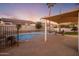 Backyard view of the outdoor living area with a refreshing pool and ample patio space at 5210 E Danbury Rd, Scottsdale, AZ 85254