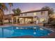 Beautiful backyard pool and patio area with a covered space, perfect for outdoor entertaining and relaxation at 5210 E Danbury Rd, Scottsdale, AZ 85254