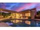 Inviting backyard pool area with patio, chairs, and pergola under a beautiful sunset sky at 6159 W Sequoia Dr, Glendale, AZ 85308