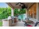 Covered patio featuring an outdoor kitchen and plenty of room for dining at 6159 W Sequoia Dr, Glendale, AZ 85308