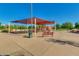 Playground with shaded seating areas and play equipment at 6159 W Sequoia Dr, Glendale, AZ 85308