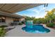 Inviting pool area with covered patio, desert landscaping, and sunny skies at 6159 W Sequoia Dr, Glendale, AZ 85308