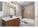 Well-lit bathroom with a modern vanity and a shower-tub combination at 6507 N 44Th Ave, Glendale, AZ 85301