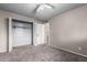 Bedroom featuring a closet with bi-fold doors and neutral paint at 6507 N 44Th Ave, Glendale, AZ 85301