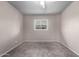 This bedroom has carpet, neutral paint, a ceiling fan, and a window at 6507 N 44Th Ave, Glendale, AZ 85301