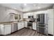 Modern kitchen with stainless steel appliances and bright white cabinets at 6507 N 44Th Ave, Glendale, AZ 85301