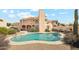 This home features a private backyard pool and spa, perfect for desert relaxation at 6717 E Saddleback Cir, Mesa, AZ 85215