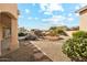 A xeriscaped backyard with desert landscaping and a stepping stone walkway offer privacy at 6717 E Saddleback Cir, Mesa, AZ 85215