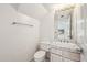 Bathroom featuring a toilet, vanity with a sink, and decorative tile at 6717 E Saddleback Cir, Mesa, AZ 85215