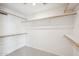 A well-organized walk-in closet with multiple shelves provides ample storage space at 6717 E Saddleback Cir, Mesa, AZ 85215