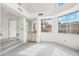 Bright living room featuring a bar area, large windows, and neutral tones throughout at 6717 E Saddleback Cir, Mesa, AZ 85215