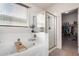 Bathroom featuring bathtub, glass enclosed shower and acces to the walking closet at 7221 W Wood St, Phoenix, AZ 85043