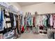 Spacious walk-in closet with ample hanging space and shelving for organized storage at 7221 W Wood St, Phoenix, AZ 85043