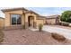 Charming single-story home featuring a two-car garage and desert landscaping at 7221 W Wood St, Phoenix, AZ 85043