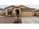 Charming single-story home featuring a two-car garage and desert landscaping at 7221 W Wood St, Phoenix, AZ 85043