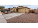 Charming single-story home featuring a two-car garage and desert landscaping at 7221 W Wood St, Phoenix, AZ 85043