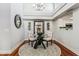 Elegant dining area with a glass table, stylish rug, and modern chandelier lighting at 7800 E Lincoln Dr # 1007, Scottsdale, AZ 85250