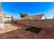 Backyard featuring a block fence, covered patio, and landscaping at 815 E Centre Ave, Buckeye, AZ 85326