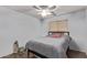 Calm bedroom featuring wood floors, a neutral color palette, and a minimalist design, creating a peaceful retreat at 815 E Centre Ave, Buckeye, AZ 85326