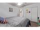 Bedroom with neutral decor, ceiling fan, closet with mirrored doors, and laminate wood flooring at 815 E Centre Ave, Buckeye, AZ 85326