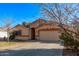 Charming single-story home with a neutral-toned exterior and a well-maintained front yard at 815 E Centre Ave, Buckeye, AZ 85326