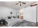 Relaxing bedroom with an ensuite bath, ceiling fan and a neutral color scheme at 815 E Centre Ave, Buckeye, AZ 85326