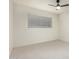 Bedroom with neutral carpet, white walls and ceiling fan with integrated lighting at 8252 E Heatherbrae Ave, Scottsdale, AZ 85251