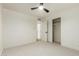 Bedroom features carpeted floors, white walls, and closet with sliding doors at 8252 E Heatherbrae Ave, Scottsdale, AZ 85251