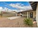 View of covered parking, a brick driveway, and a well-maintained yard add to the home's curb appeal at 8252 E Heatherbrae Ave, Scottsdale, AZ 85251