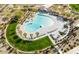 Aerial view of resort-style community pool with surrounding lounge chairs and landscaping at 8907 W Bethany Heights Dr, Glendale, AZ 85305