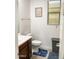 Neutral bathroom featuring a toilet, single vanity with a dark wood cabinet, and a framed art piece above the toilet at 8907 W Bethany Heights Dr, Glendale, AZ 85305