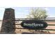 StoneHaven community entrance sign with stone pillar, landscaping and wrought iron fencing at 8907 W Bethany Heights Dr, Glendale, AZ 85305