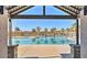 Community pool with palm trees, lounge chairs and covered structure for relaxing poolside at 8907 W Bethany Heights Dr, Glendale, AZ 85305