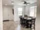 Bright dining area with a window and a wooden table with seating for six at 8907 W Bethany Heights Dr, Glendale, AZ 85305