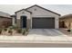 Charming single-story home featuring a well-manicured front yard and an attached two-car garage at 8907 W Bethany Heights Dr, Glendale, AZ 85305