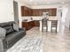 Cozy kitchen and living area with dark cabinets and tiled flooring at 8907 W Bethany Heights Dr, Glendale, AZ 85305