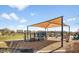 Community playground with shade structure, landscaping and seating area at 8907 W Bethany Heights Dr, Glendale, AZ 85305