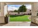 View of the backyard featuring a well-maintained lawn and privacy fence at 901 N Woodburne Dr, Chandler, AZ 85224