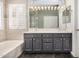 Bathroom showcasing a gray double vanity cabinet with a white countertop at 901 N Woodburne Dr, Chandler, AZ 85224