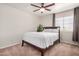 Cozy bedroom with dark wood bed frame, neutral walls, and natural light at 901 N Woodburne Dr, Chandler, AZ 85224