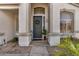 Inviting front entrance with decorative wreath, arched windows, and well-maintained desert landscaping at 901 N Woodburne Dr, Chandler, AZ 85224