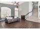 Open living space with wood-look tile, neutral walls, and a staircase leading to the upper level at 901 N Woodburne Dr, Chandler, AZ 85224