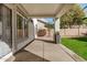 Covered patio with pillars, overlooking a lush green backyard at 901 N Woodburne Dr, Chandler, AZ 85224