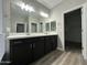 Bathroom featuring a dual sink vanity, generous counter space, and great lighting at 9017 W Kirby Ave, Tolleson, AZ 85353