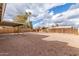 A spacious backyard features gravel landscaping and a covered patio at 904 W Tulane Dr, Tempe, AZ 85283