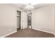 Bedroom featuring a ceiling fan, carpet and a large closet at 904 W Tulane Dr, Tempe, AZ 85283