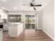 Bright kitchen with granite countertops, white cabinets, and sliding door to the backyard at 904 W Tulane Dr, Tempe, AZ 85283