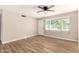 Bright and airy living room with wood-look floors, ceiling fan, and ample natural light at 904 W Tulane Dr, Tempe, AZ 85283